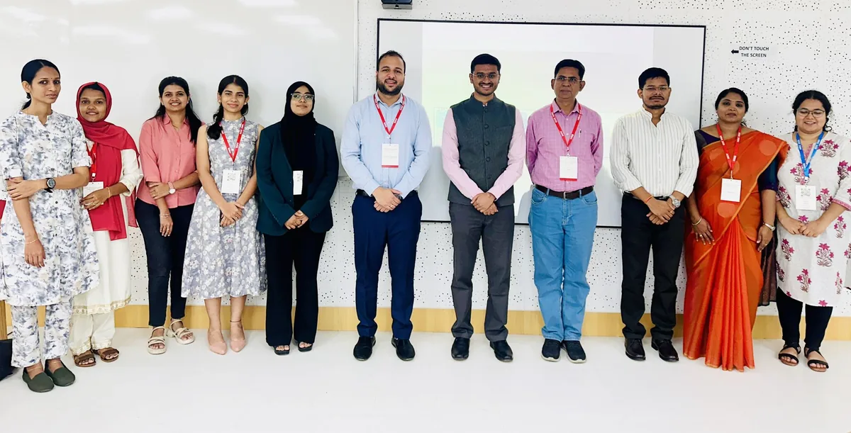 Prof. Sudhanshu Maheshwari with an executive programme cohort wearing programme name badges in a training room