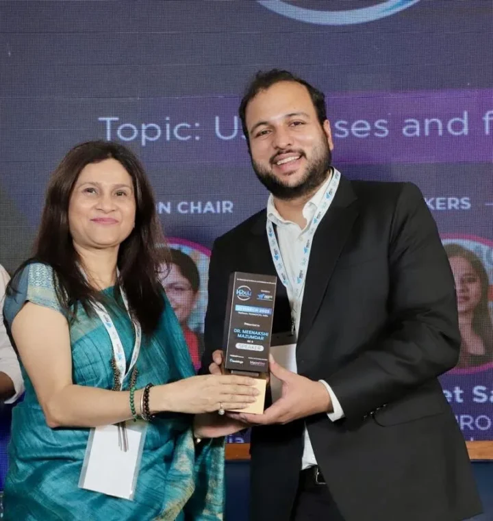 Receiving a trophy on stage at the summit