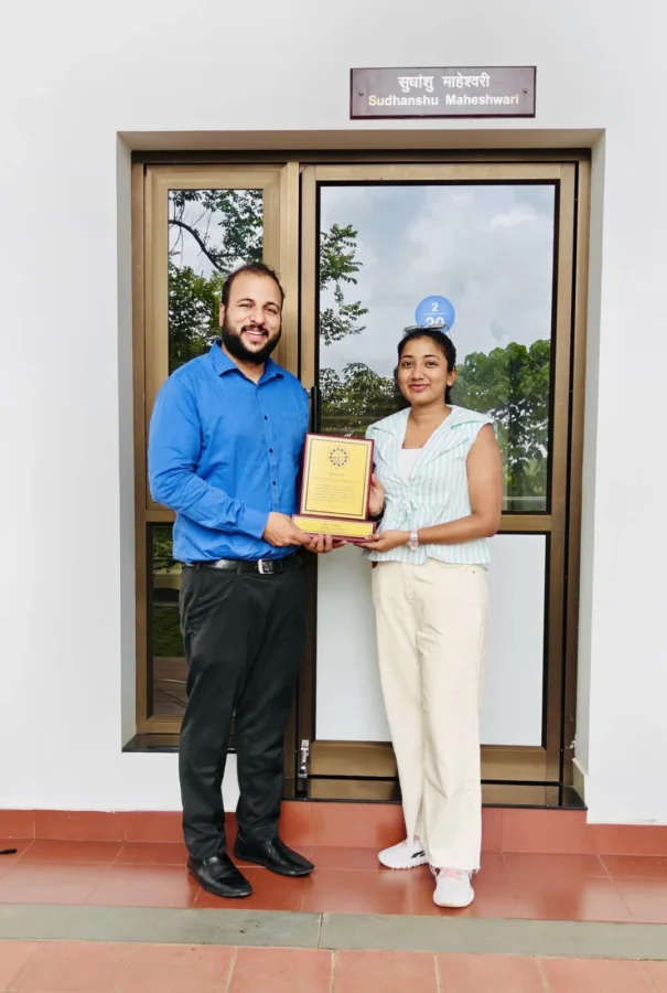 Presenting a framed memento beside a doorway