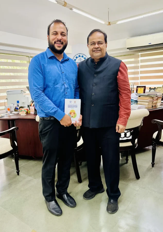 Presenting a book to a guest in an office