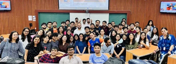 Participants seated in a wood-panelled lecture hall