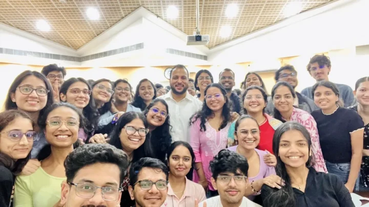 A large group of students photographed together in a hall