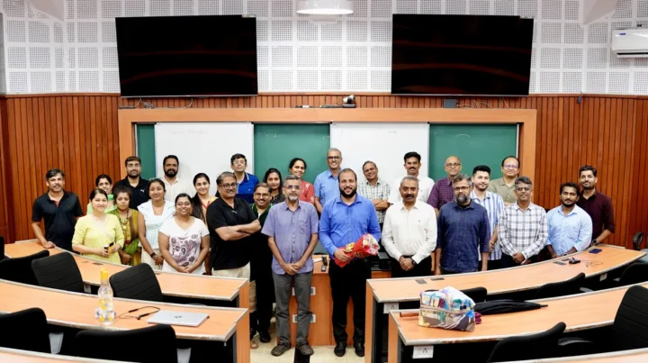 Participants seated around a large seminar table