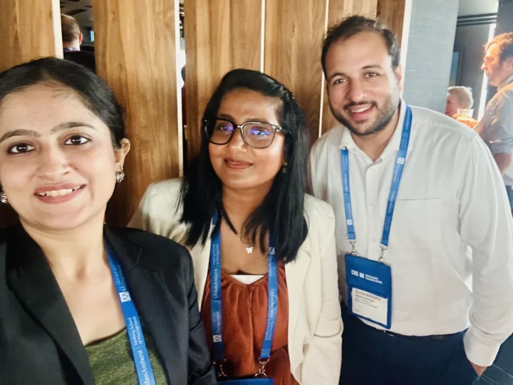 Three delegates photographed together at the conference