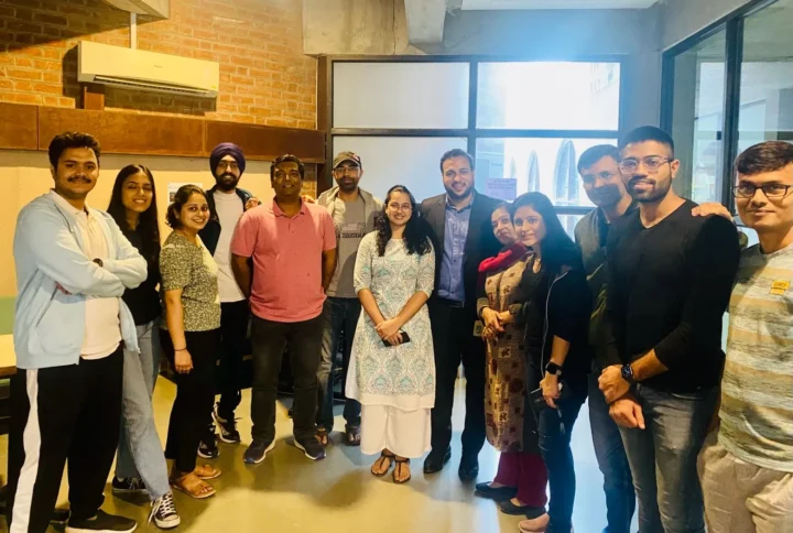 A group of colleagues gathered together at a celebration