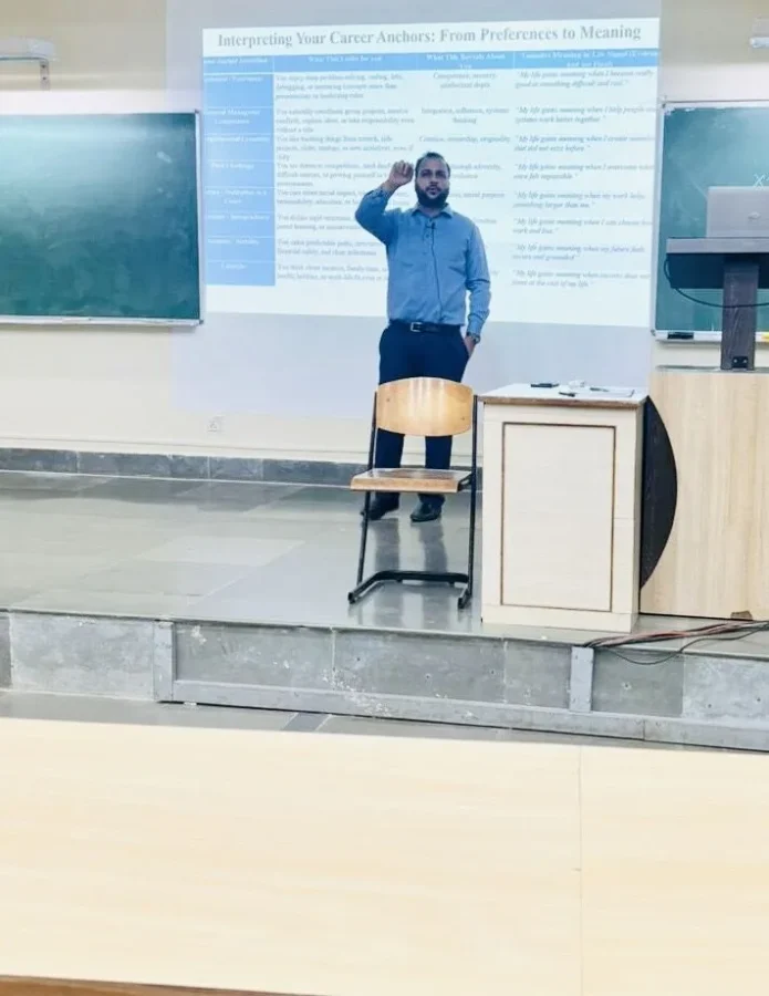 Presenting beside a projected slide during the guest lecture