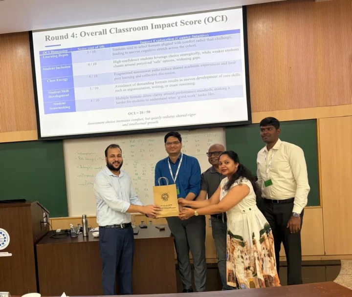 A memento presented in front of a slide reading Overall Classroom Impact Score