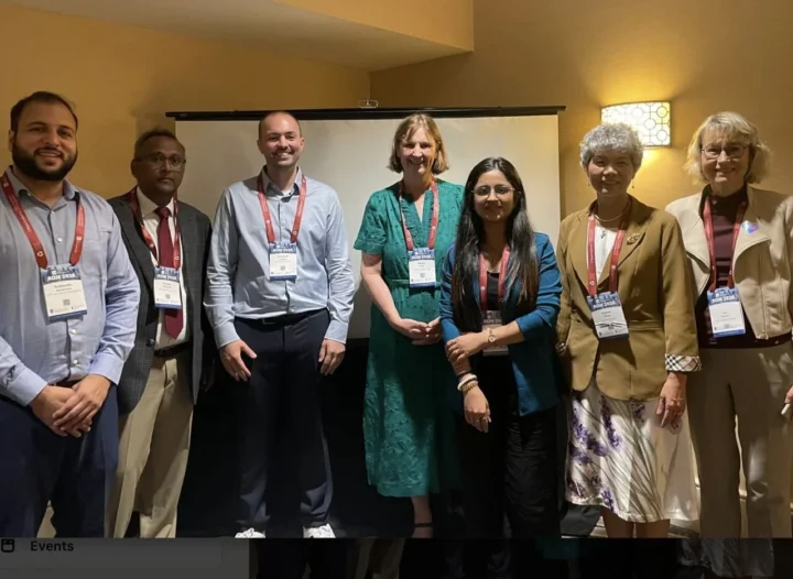The panel of scholars from the AI in Talent Acquisition symposium standing together after the session