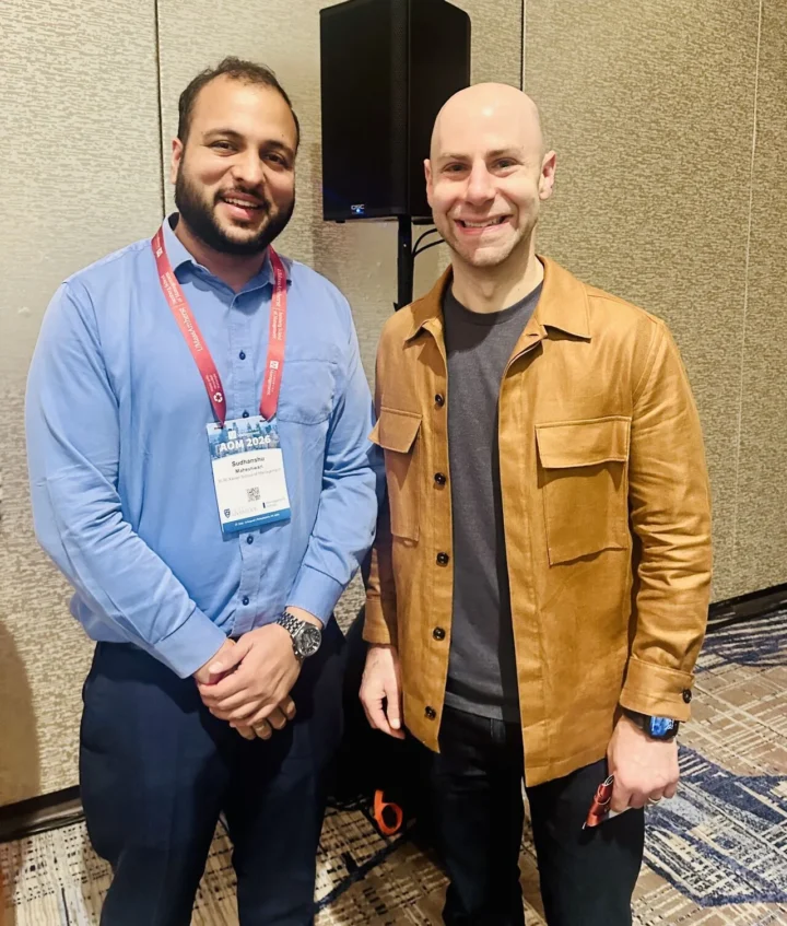 Standing with Adam Grant at the Academy of Management Annual Meeting 2026 in Philadelphia