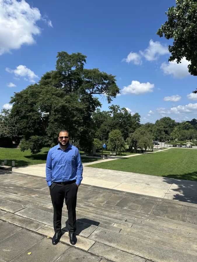 Standing outdoors on a bright day in Philadelphia during the Academy of Management Annual Meeting